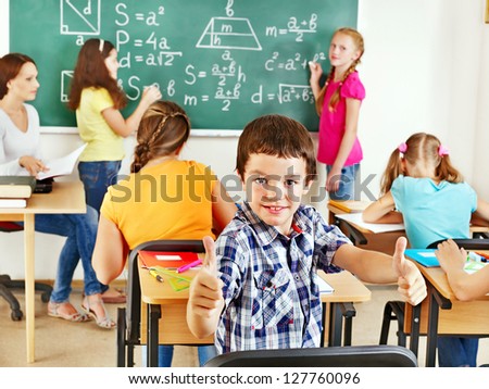 School child with teacher in classroom School child with teacher in classroom