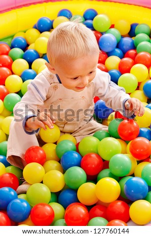 Little boy in colored ball.