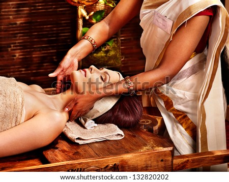 Woman having facial ayurveda spa treatment Woman having facial ayurveda spa treatment