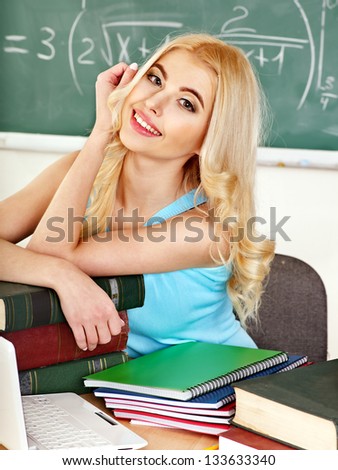 Happy student in classroom .