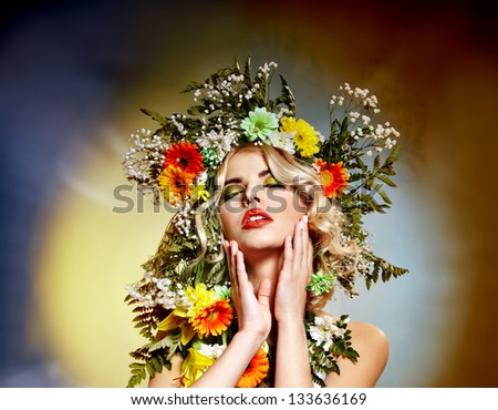 Portrait of woman with flower hairstyle.Art photo.