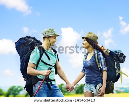 Couple with backpack  summer outdoor.