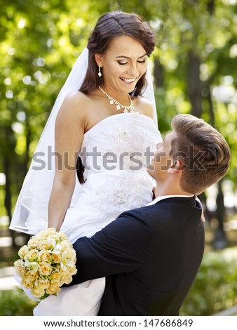 Bride and groom with flower summer  outdoor.