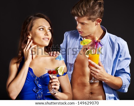 Beauty couple with glass of cocktail.