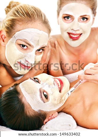 Group woman getting facial mask and gossip . Isolated.