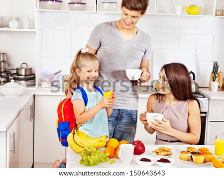 Parents prepare  child for school. Happy family.