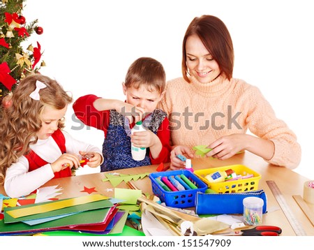 Children boy and girl making decoration for Christmas.