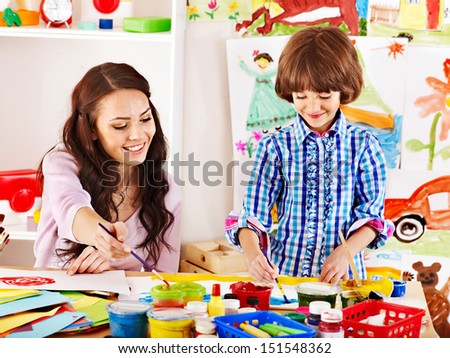 Family with children  painting  in school. Education.