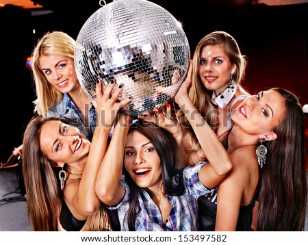 Group People On Disco In Night Club. Lighting Effects.