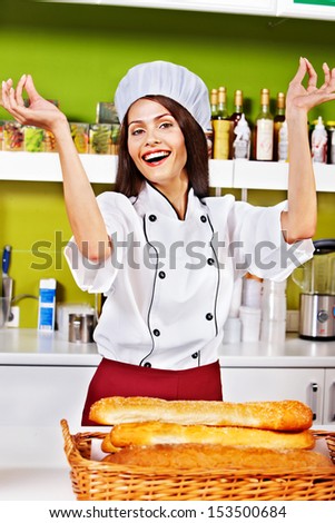 Female chef baking baguette bread
