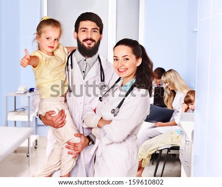 Group doctors exam children.