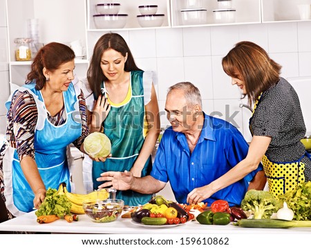 Big family cooking at kitchen. Grandfather and grandmother.