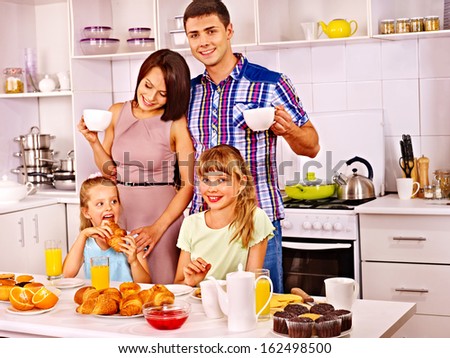Parents prepare  breakfast for child. Happy family.
