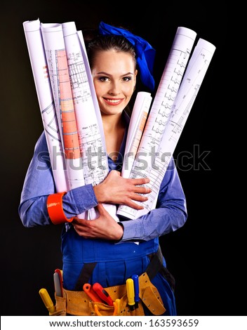 Builder woman with roll wallpaper. Fashion,