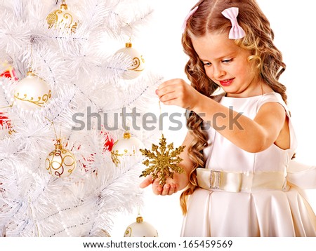 Child holding snowflake to decorate Christmas tree . Isolated.