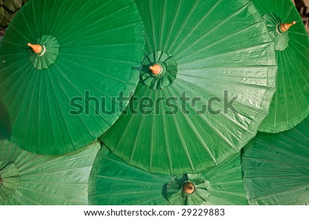 Background of green chinese umbrella. Design.