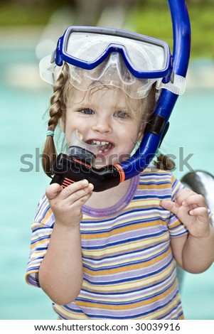 Child learn to swim . Swimming pool.