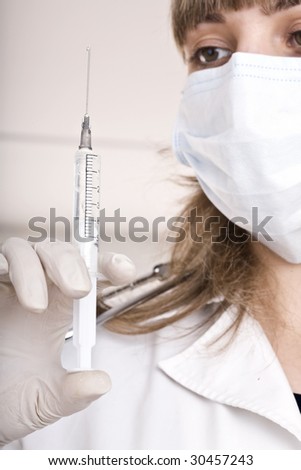 Medicine doctor with syringe in office. Vaccination.