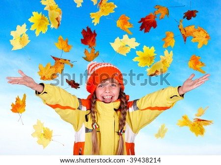 Girl child in autumn orange hat with outstretched arm. Outdoor.
