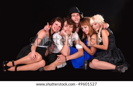 Group happy young people on black background.