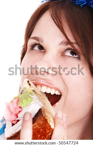Face of girl eating cake. Isolated.