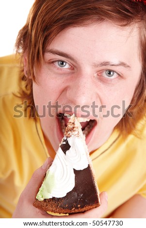 Face of man eating cake. Isolated.