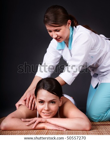 Beautiful white girl having thai massage. Beauty spa.