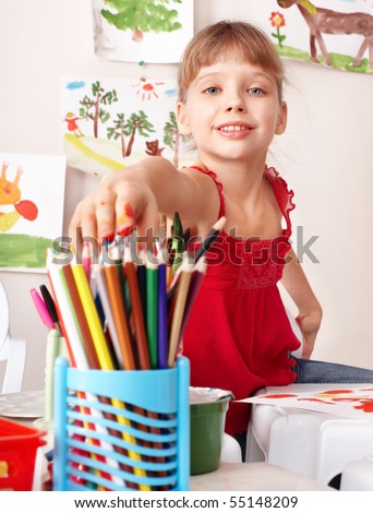 Child drawing colour pencil in preschool. Childcare/