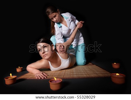 Beautiful white girl having thai massage.
