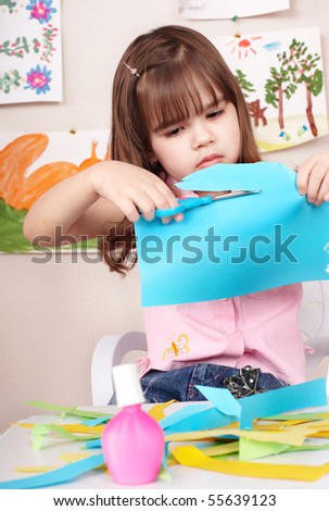 kid cutting paper