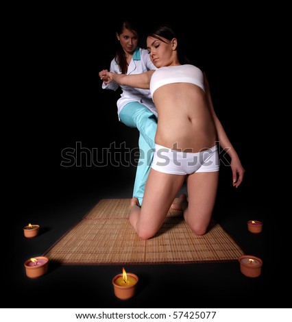 Beautiful white girl having thai massage.