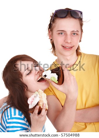 Man  and girl eating cake. Isolated.