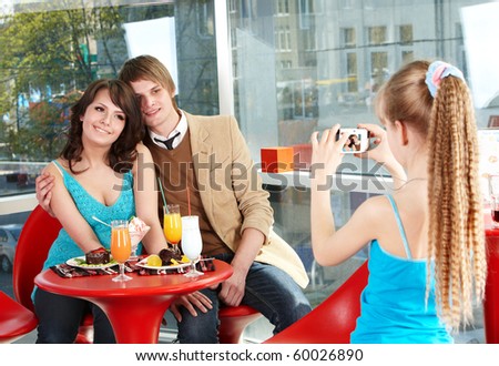 Happy family with child in restaurant. Childhood.