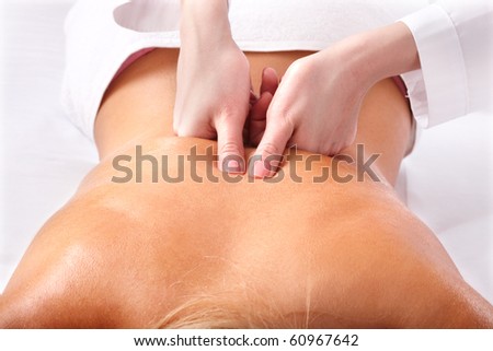 Massage of female back. Health and beauty.