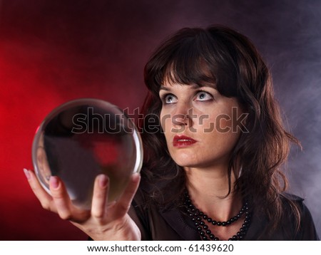 Young woman  with crystal ball. Beauty and fashion.