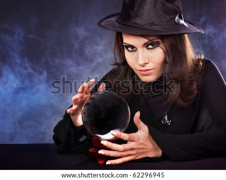 Young beautiful woman with crystal ball.