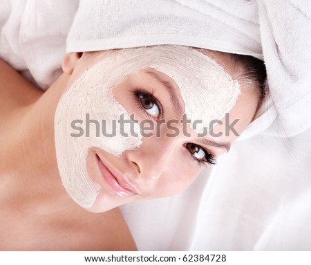 Young woman with clay facial mask Young woman with clay facial mask