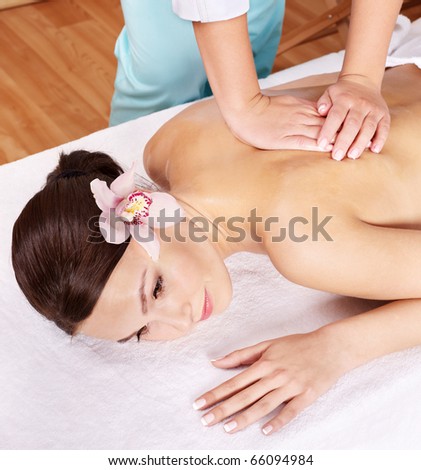 Young beautiful woman on massage table in beauty spa.  Series.