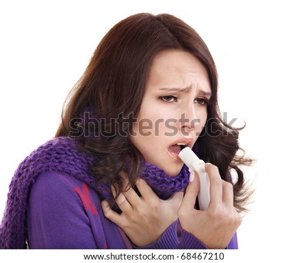 stock photo Young woman using throat spray