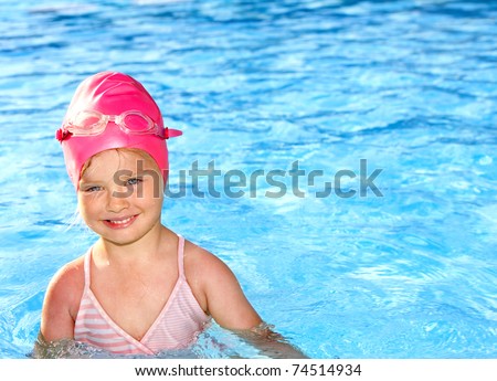 Little girl  swimming in pool.