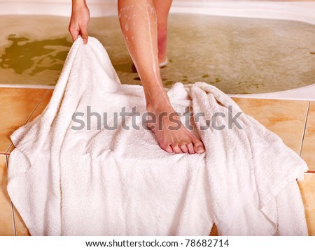Woman in bath tub. Low section.
