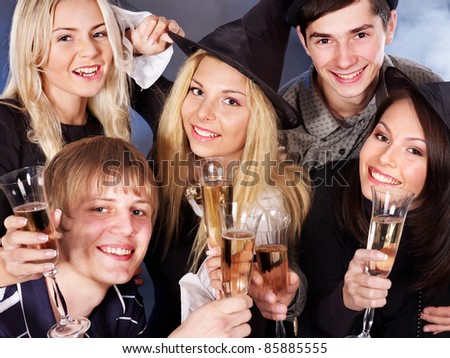 Group young people drinking champagne at nightclub.