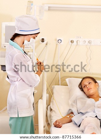 Doctor treats female patient with stethoscope. Medicine. Medicine.