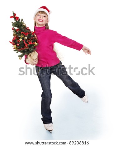 Happy young girl figure skating with christmas tree. Isolated.