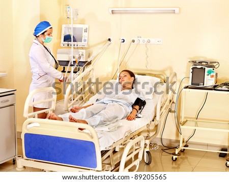 Doctor treats female patient with stethoscope. Medicine. Medicine.