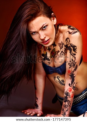 Young beautiful woman with body art .