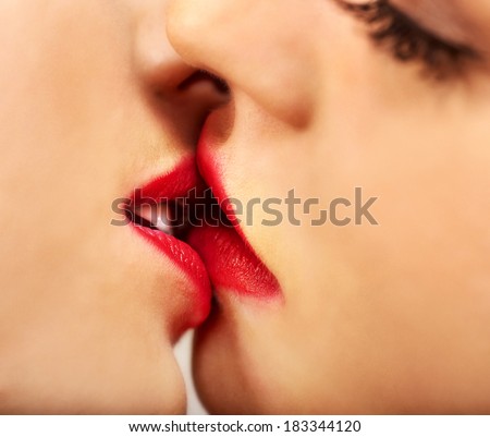 Face sexy lesbian women kissing in erotic foreplay game. Isolated.