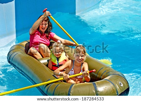 Family with children  ride  rubber boat at  swimming pool .