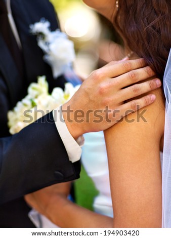 Body part bride and groom holding flower summer  outdoor.
