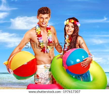 Couple with beach accessories at Hawaii . Summer outdoor.